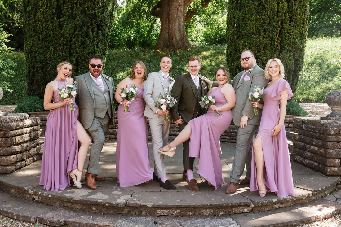 Groom and groomsmen wearing ties that perfectly match bridesmaids’ dresses at an elegant wedding