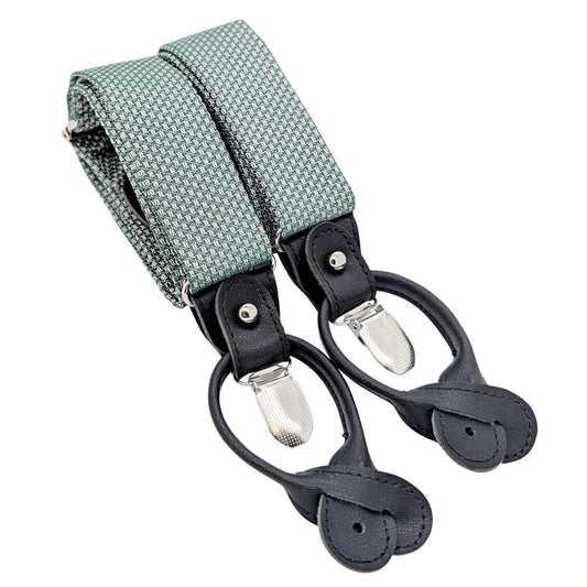 A pair of adjustable suspenders with a woven sage green and white patterned fabric strap, black leather loops, and silver metal snap clips, shown on a plain white background.