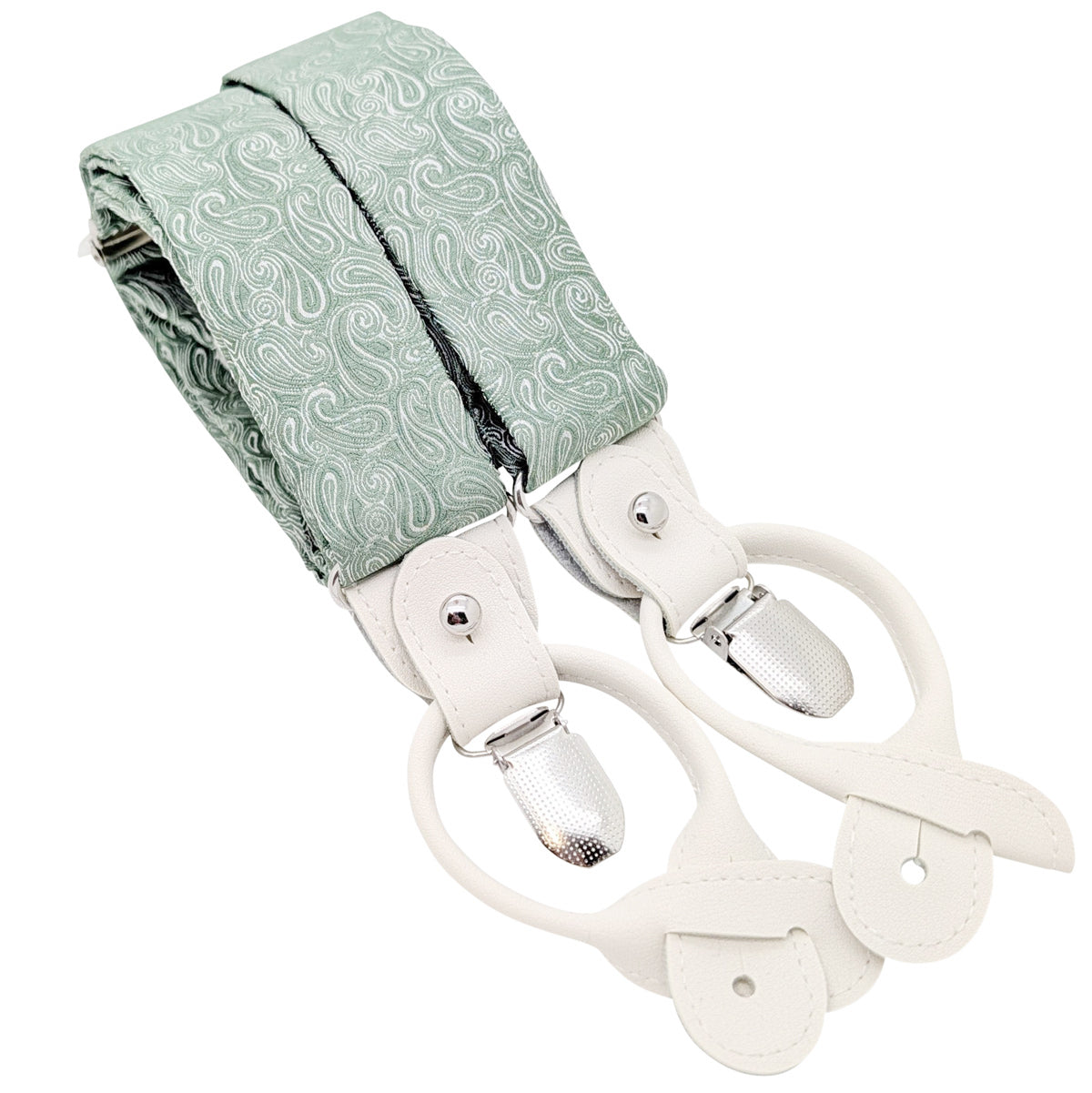 A pair of suspenders with a sage green paisley patterned fabric strap and cream-colored leather clips and loops, shown on a plain white background.